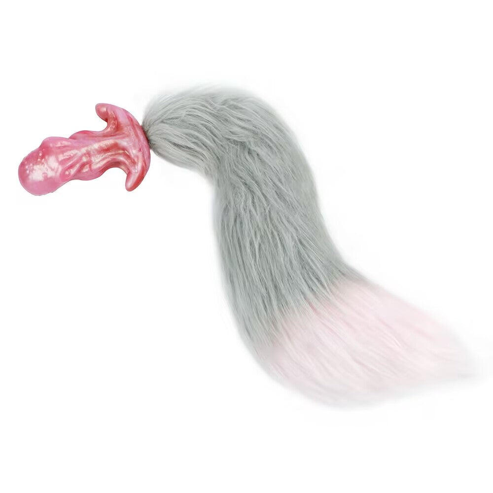Pink octopus fantasy plug attached with a long fluffy brown faux fur fox tail for roleplay.