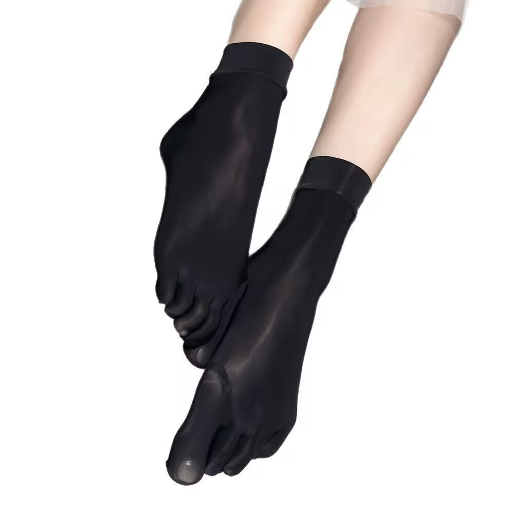 Black five-toe mid-calf socks isolated on clean white background.