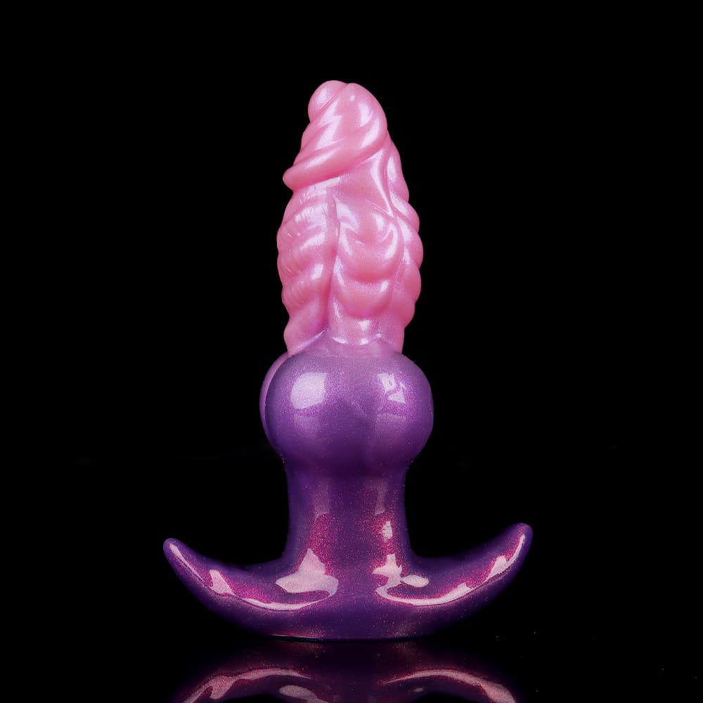 A fantasy dragon-scale butt plug with a wide T-bar safety anchor base designed to prevent slipping, shown in its original uninflated state.