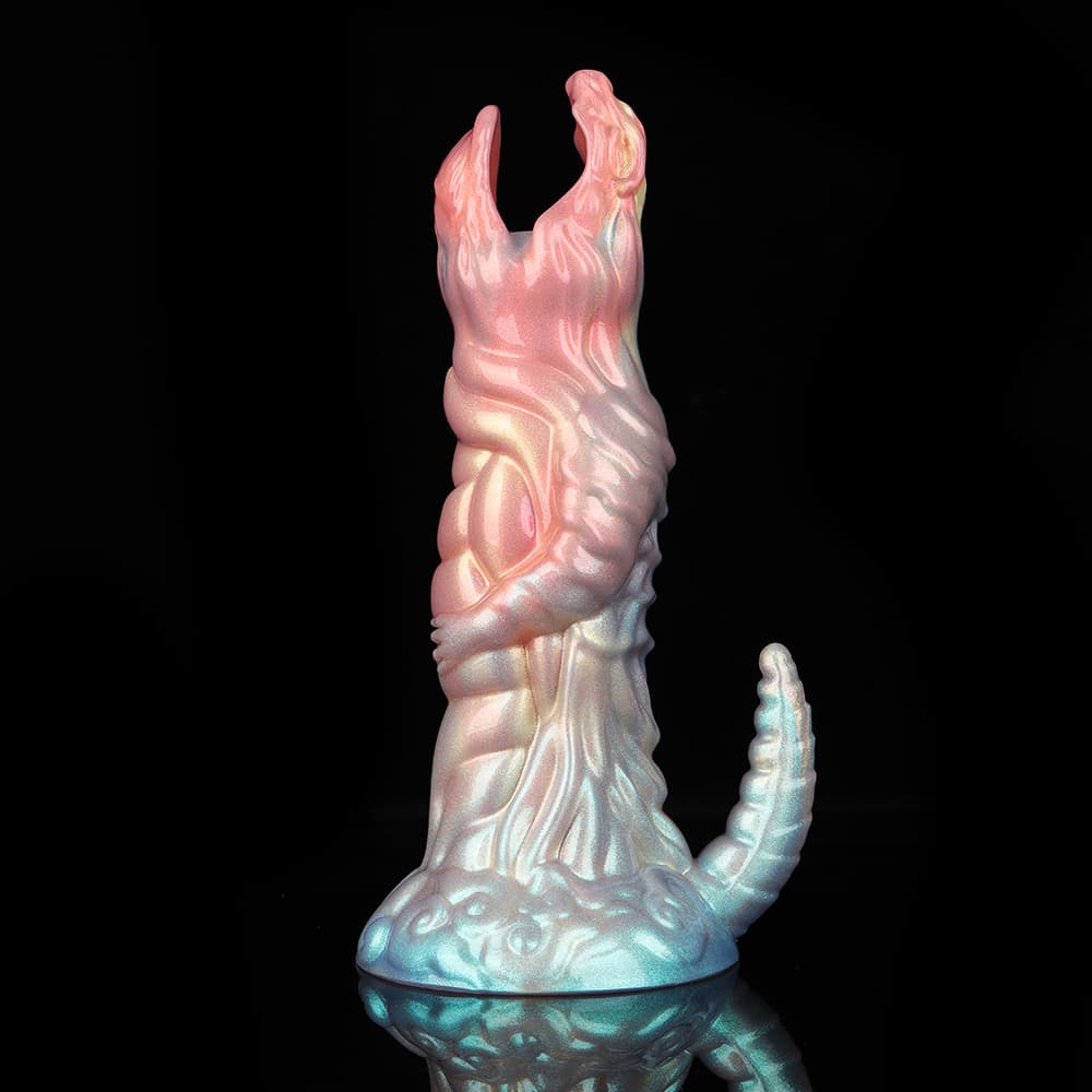 A side profile product shot of the pearlescent fantasy oviposition dildo standing on a glossy black surface, capturing the dual-tone pink and light blue light reflections.
