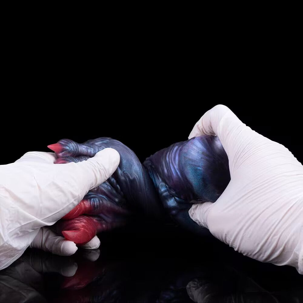Soft TPE alien foot stroker being twisted to display material durability and flexibility.