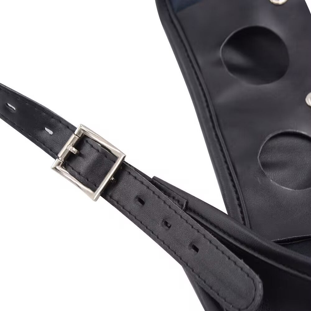 Detail of the adjustable belt buckle and hole strap on the black PU leather strap-on harness for custom fit