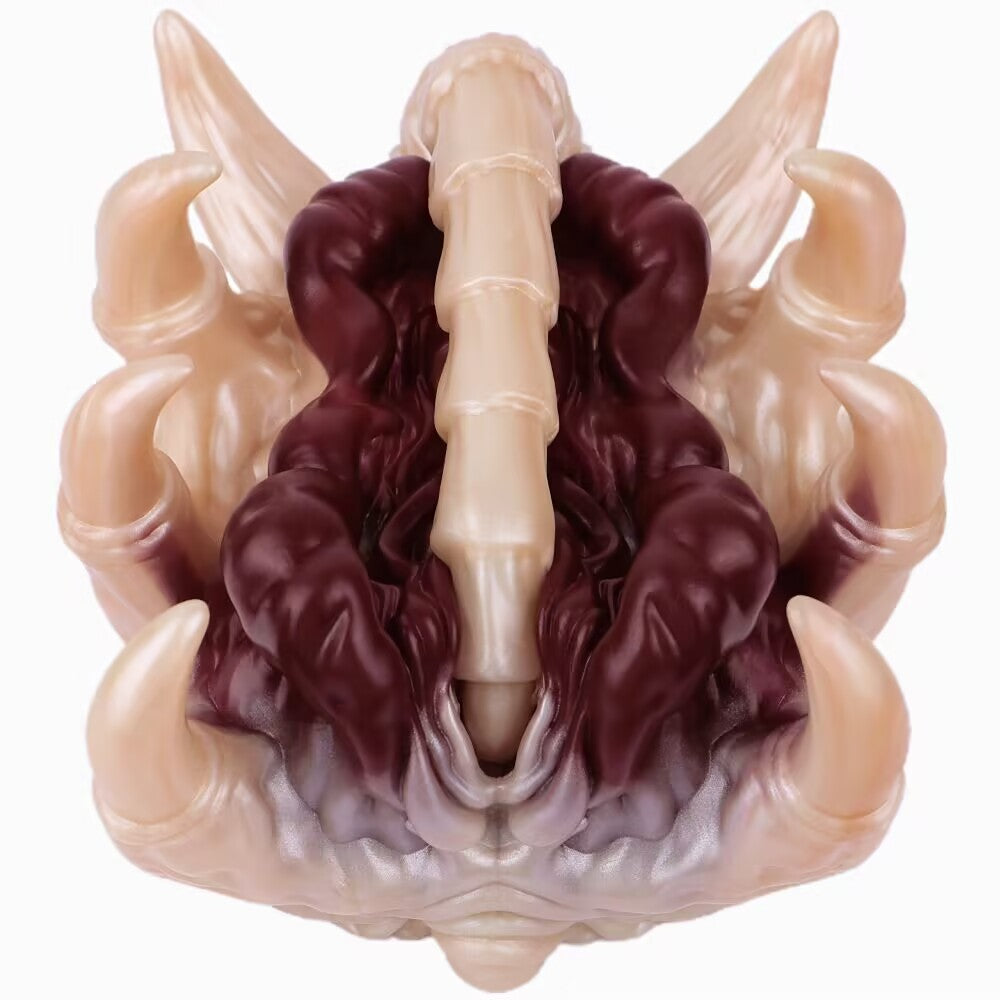 Top-down view of alien facehugger stroker displaying dark purple organic inner ribbed canal