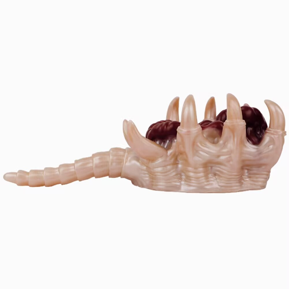 Side view of alien facehugger fantasy stroker showing organic texture and curved tail