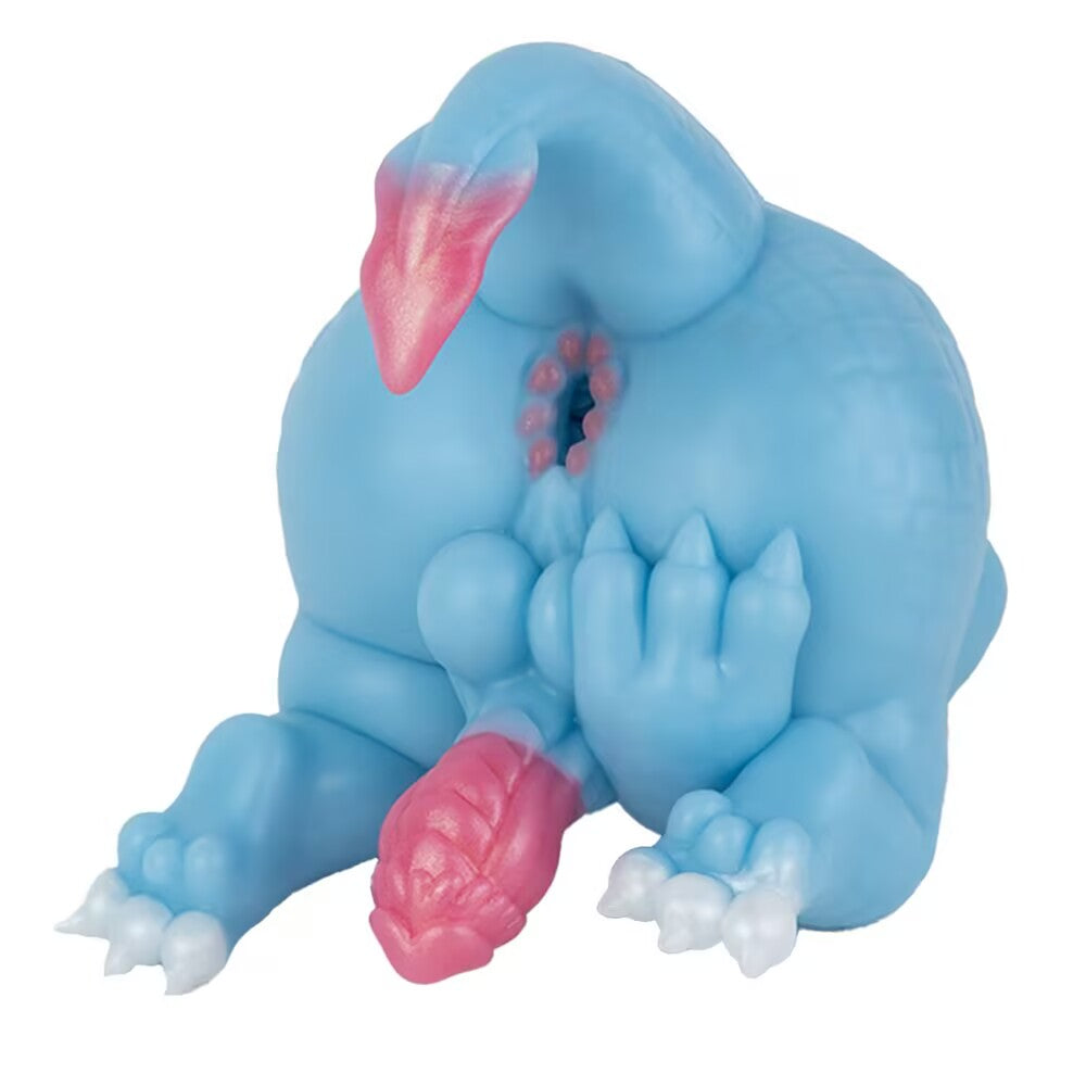 Close-up rear view of the squatting Azure dragon adult toy, highlighting the upper entry channel under the curled pink-tipped tail.