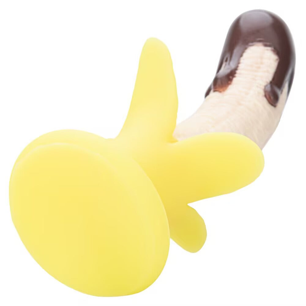 Bottom view showing the strong suction cup base on a banana novelty silicone dildo.