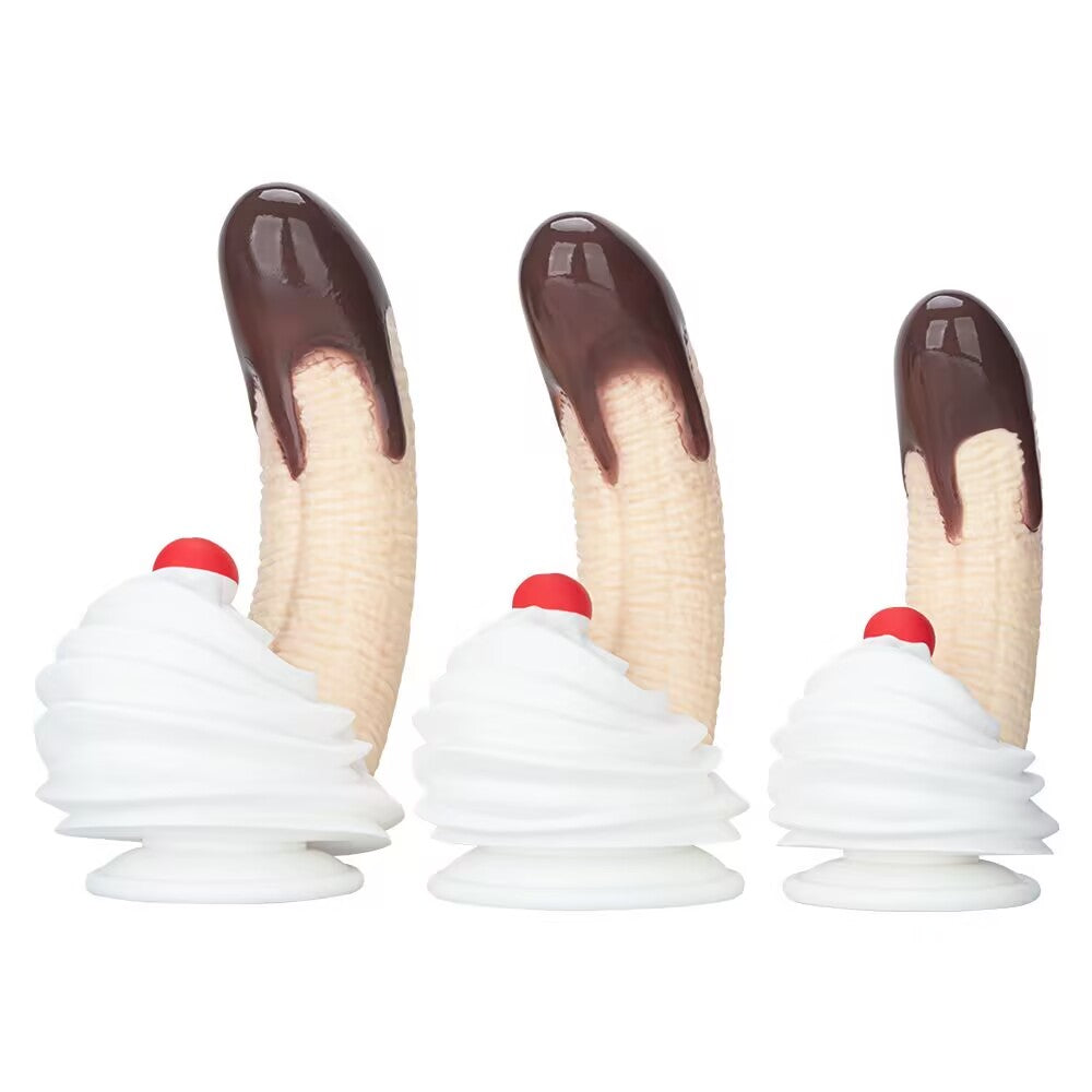Three sizes of banana split chocolate dildos with whipped cream suction cup bases shown together.