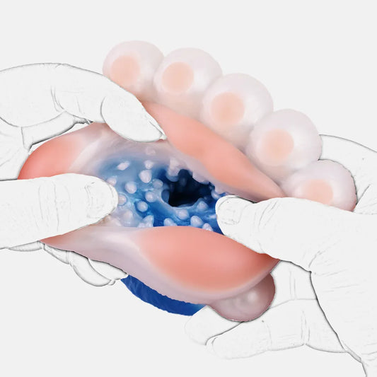 Close-up of hands stretching open the pink paw pad entry of the blue TPE stroker to reveal intense inner channel textures, ribs, and stimulating nodules.