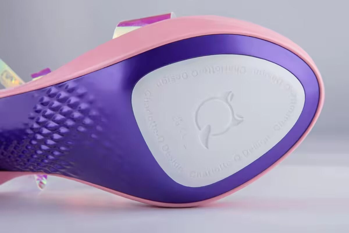 Sole detail of Charlotte-Q Design high heel stroker showing purple texture and branded logo stamp