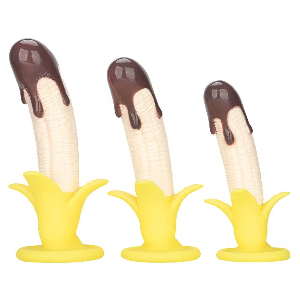 Three sizes of chocolate dipped banana silicone dildos with suction cup base displayed side by side.