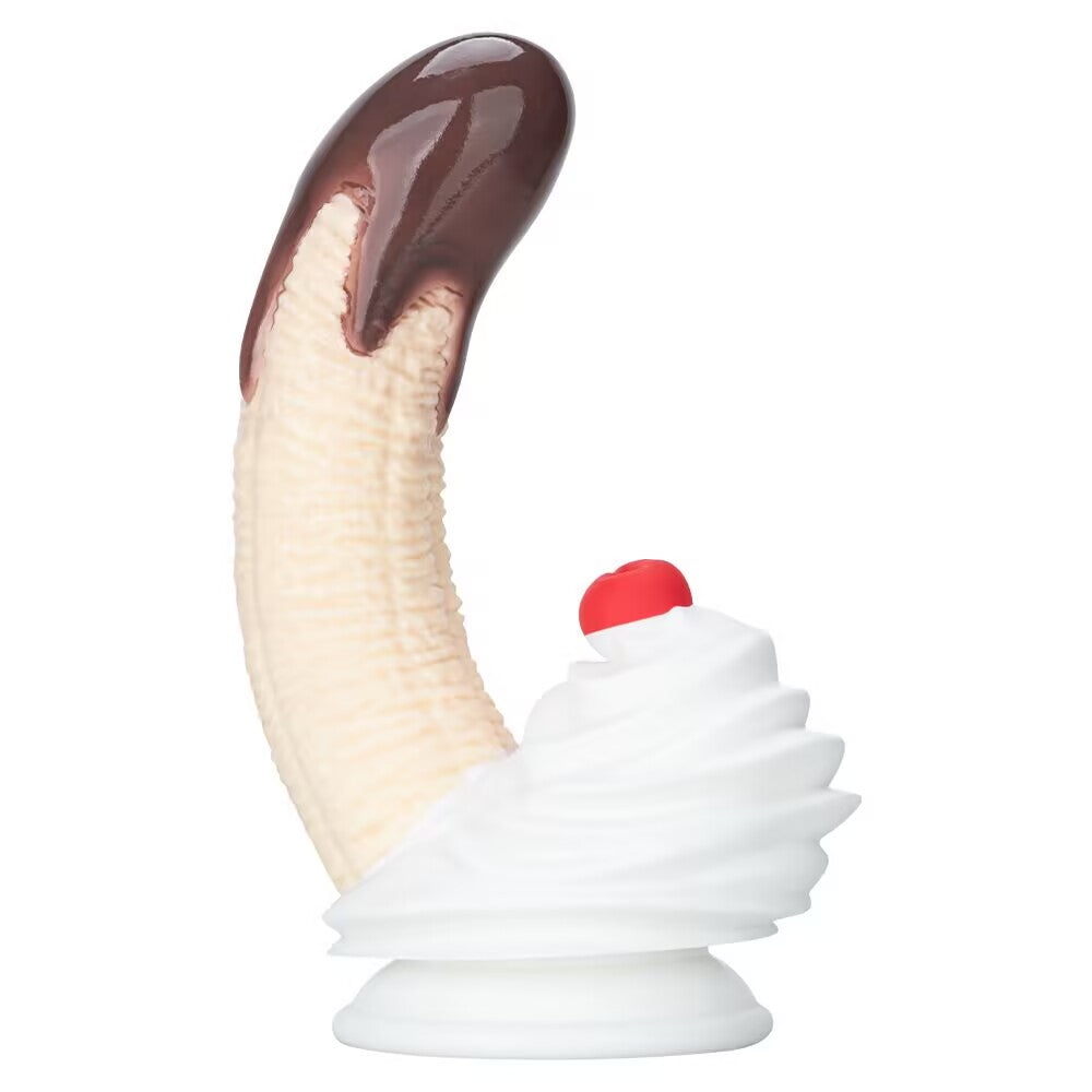Side profile view of the chocolate dipped banana dildo showing curved shaft and whipped cream base.