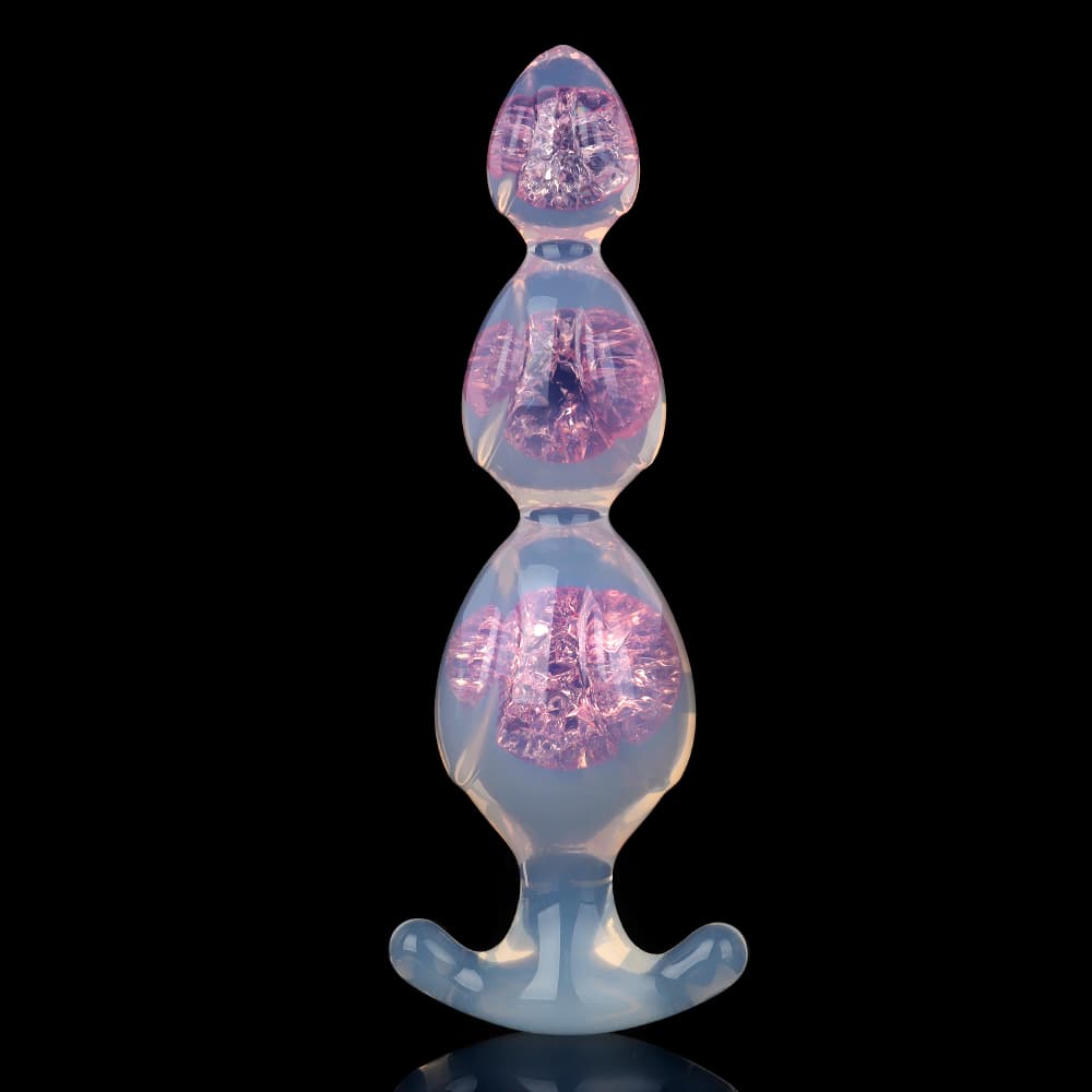 Clear pink silicone graduated anal plug with a shiny diamond foil core on a black background.