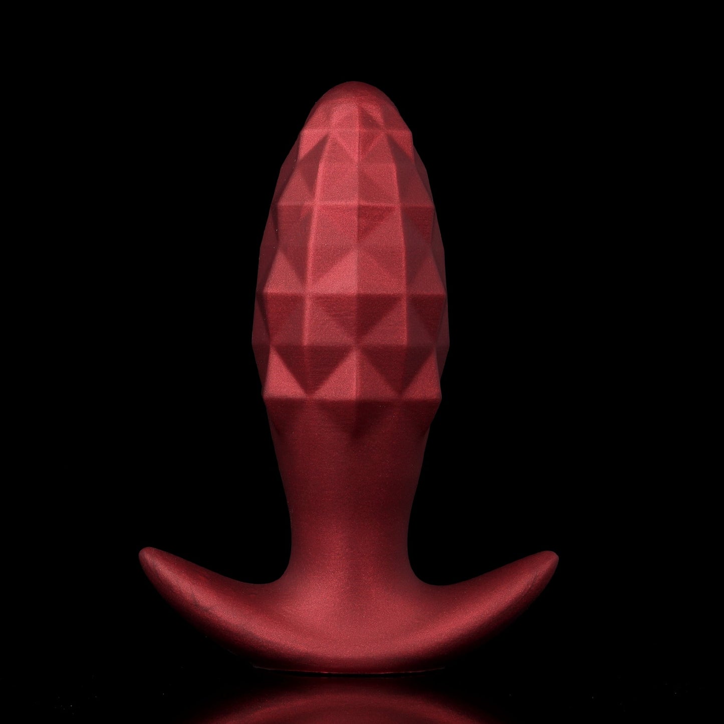 A matte crimson red inflatable silicone butt plug featuring a detailed geometric diamond pattern and a comfortable flared security anchor base.