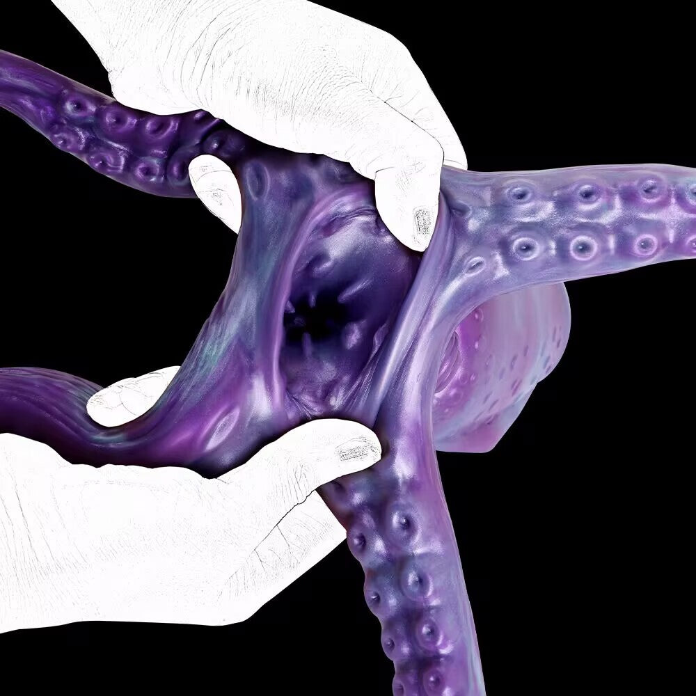 Hands opening the internal channel of Cthulhu tentacle masturbator to show textured ribs and elasticity