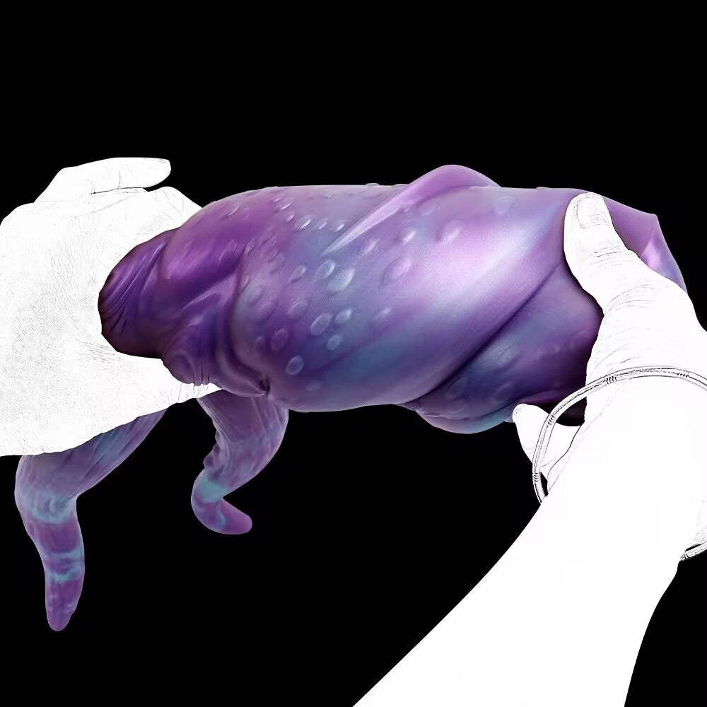 Hands squeezing the textured outer surface of the purple octopus monster male stroker