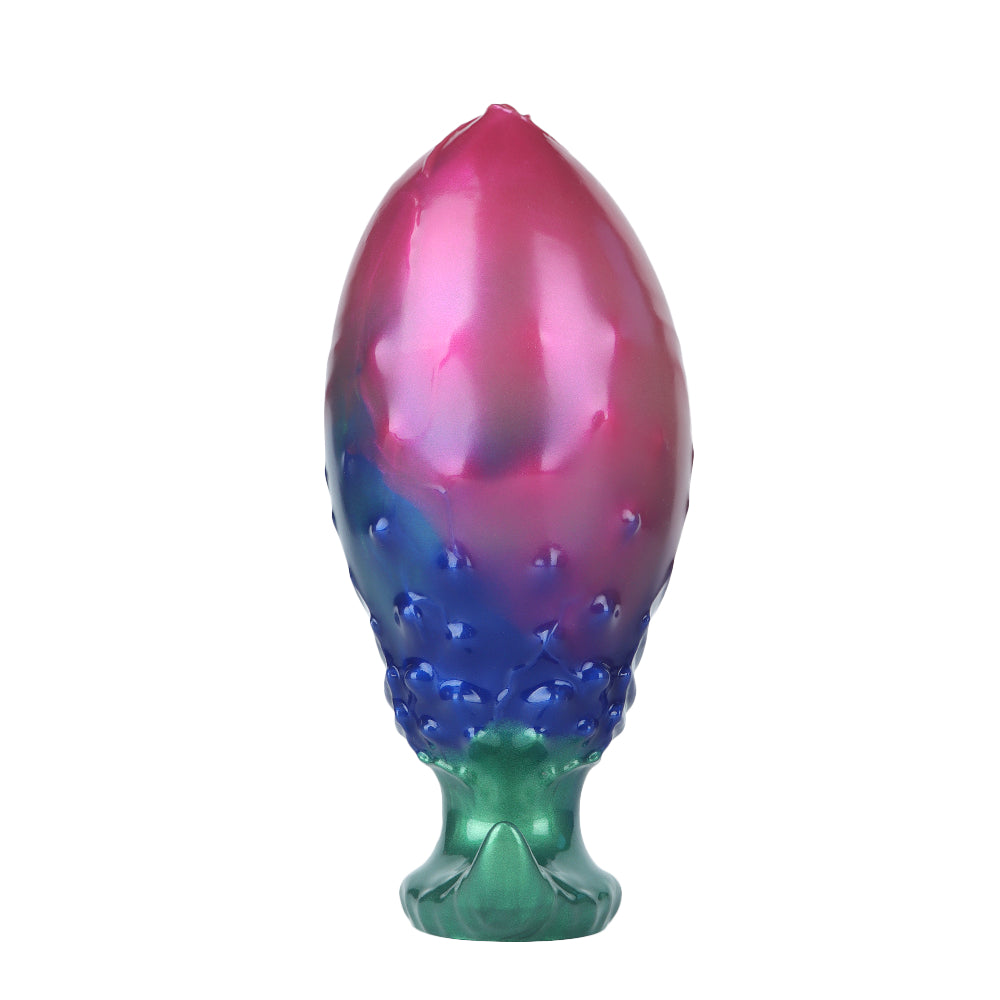 The smooth, uninflated dome tip of an expandable metallic fantasy butt plug designed for comfortable insertion.