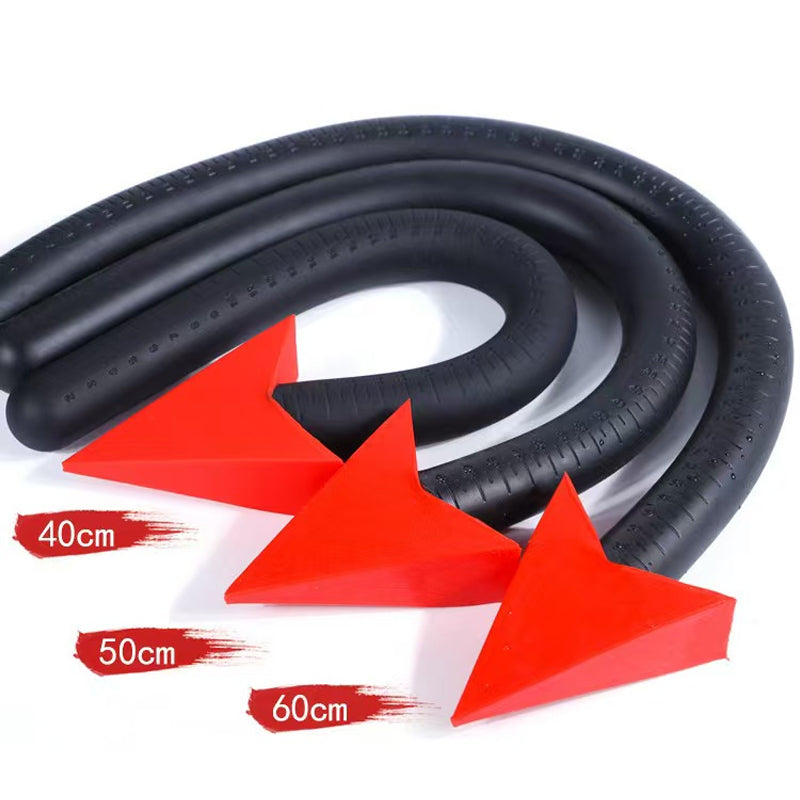 Three sizes of flexible devil tail anal probes stacked with vibrant red arrow stoppers