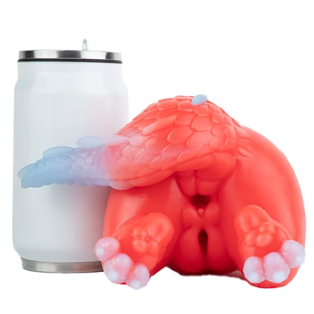 Size comparison of the Crimson dragon silicone toy placed next to a standard tumbler can to show its massive scale.