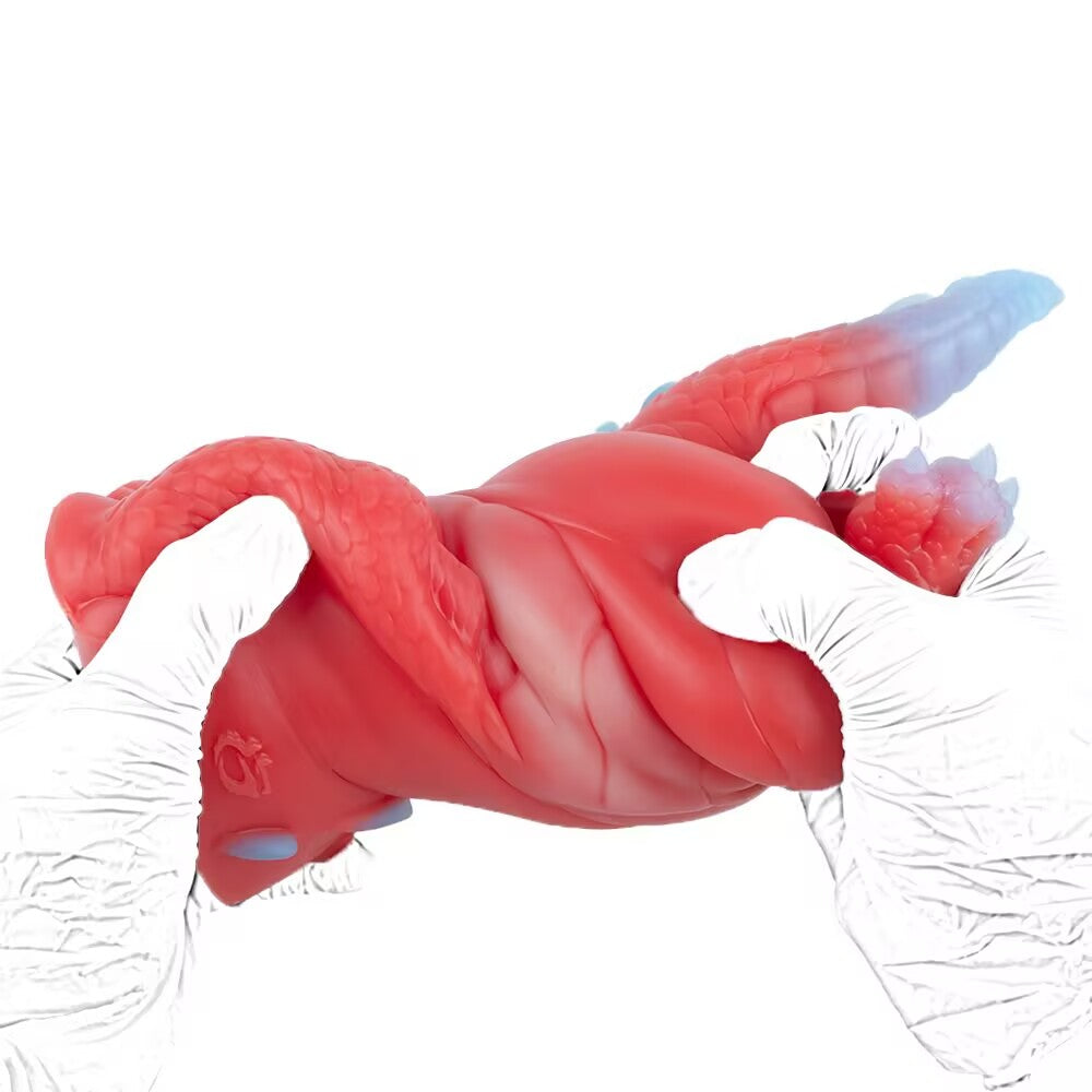 Hands twisting the body of the Crimson dragon toy to demonstrate the extreme elasticity and durability of the high-quality liquid silicone.