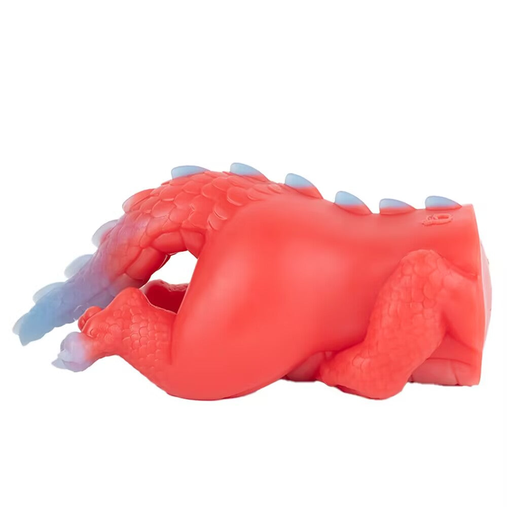 Side profile of the Crimson dragon adult toy laying down, displaying the ergonomic curves and scaly legs.