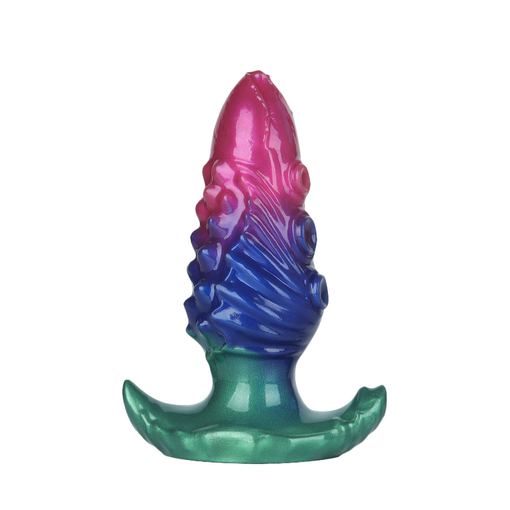Side view of a textured purple and blue fantasy octopus anal plug with a green dual-anchor flared safety base.