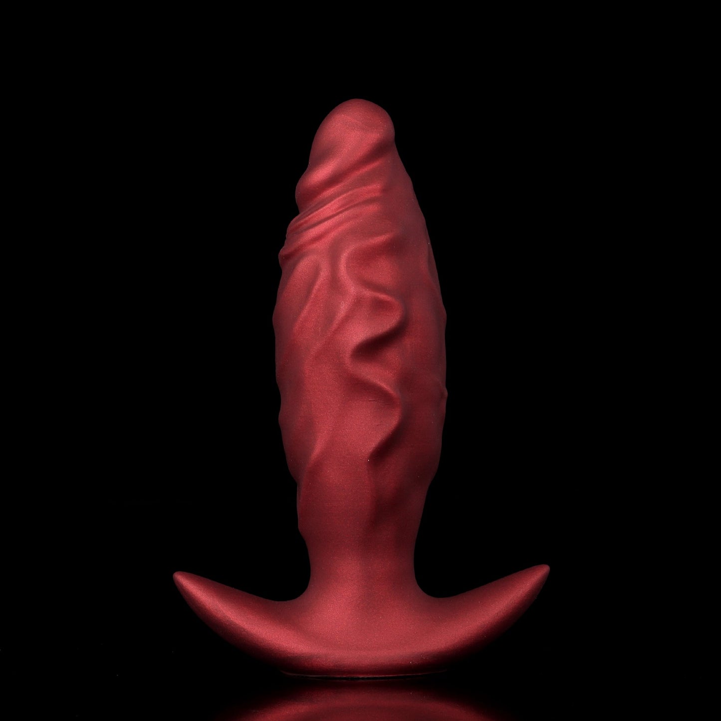 Side-by-side comparison of a crimson red inflatable fantasy dilator before and after being pumped into a large egg shape.