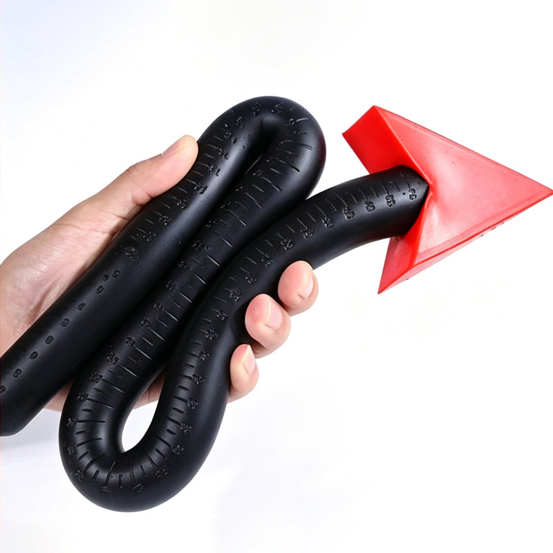 High flexibility demonstration of black silicone devil tail anal probe folded in hand