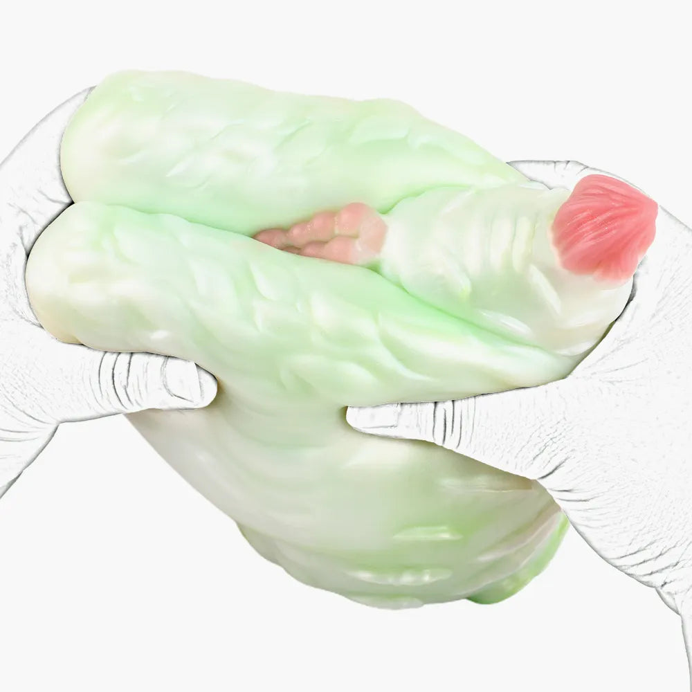 Two hands squeezing the flexible TPE fantasy beast toy to showcase its ultra-soft and squishy material.
