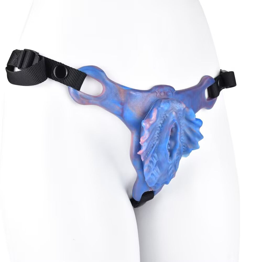 Side profile of floral-style ergonomic grinder pad with organic ridged texture and waist straps