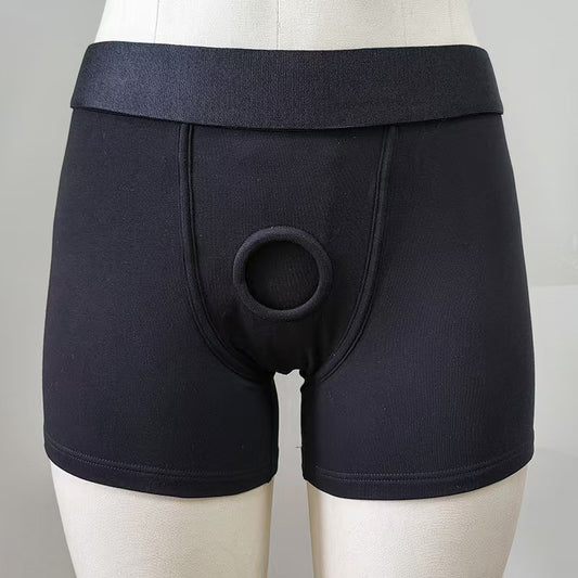 Front view of black FTM packing underwear boxer briefs featuring a built-in 4.5cm elastic O-ring on a mannequin.