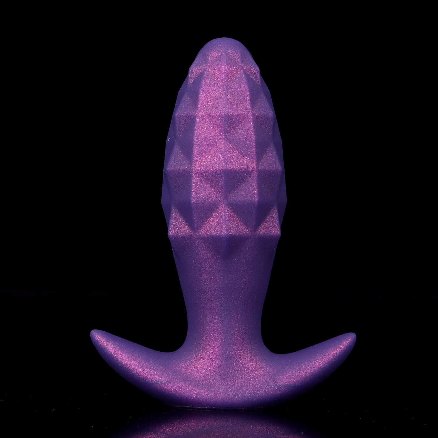 A galactic purple inflatable silicone butt plug infused with metallic shimmer dust, featuring a geometric diamond-cut bulb and a wide flared base.
