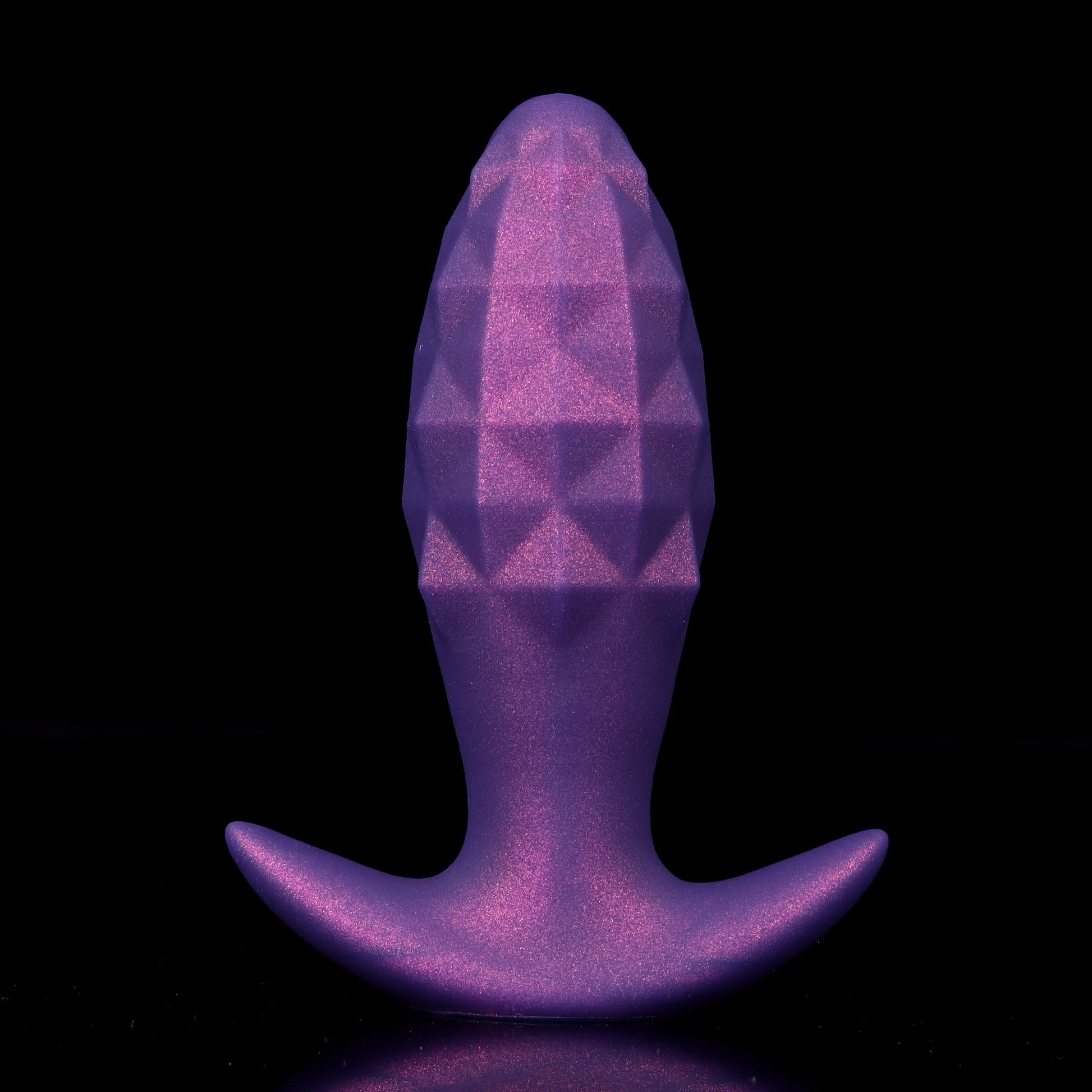 A galactic purple inflatable silicone butt plug infused with metallic shimmer dust, featuring a geometric diamond-cut bulb and a wide flared base.