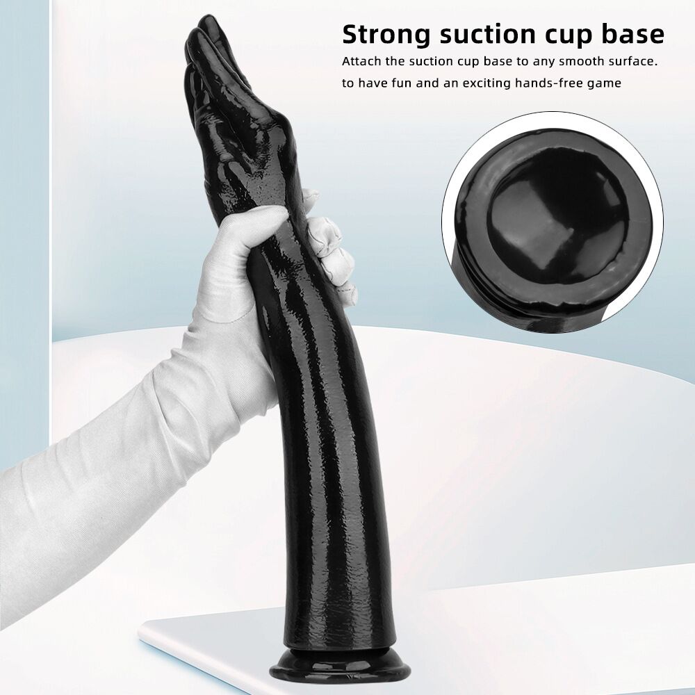 A gloved hand holding the long black arm dildo showcasing the strong suction cup base and hands-free play capabilities.