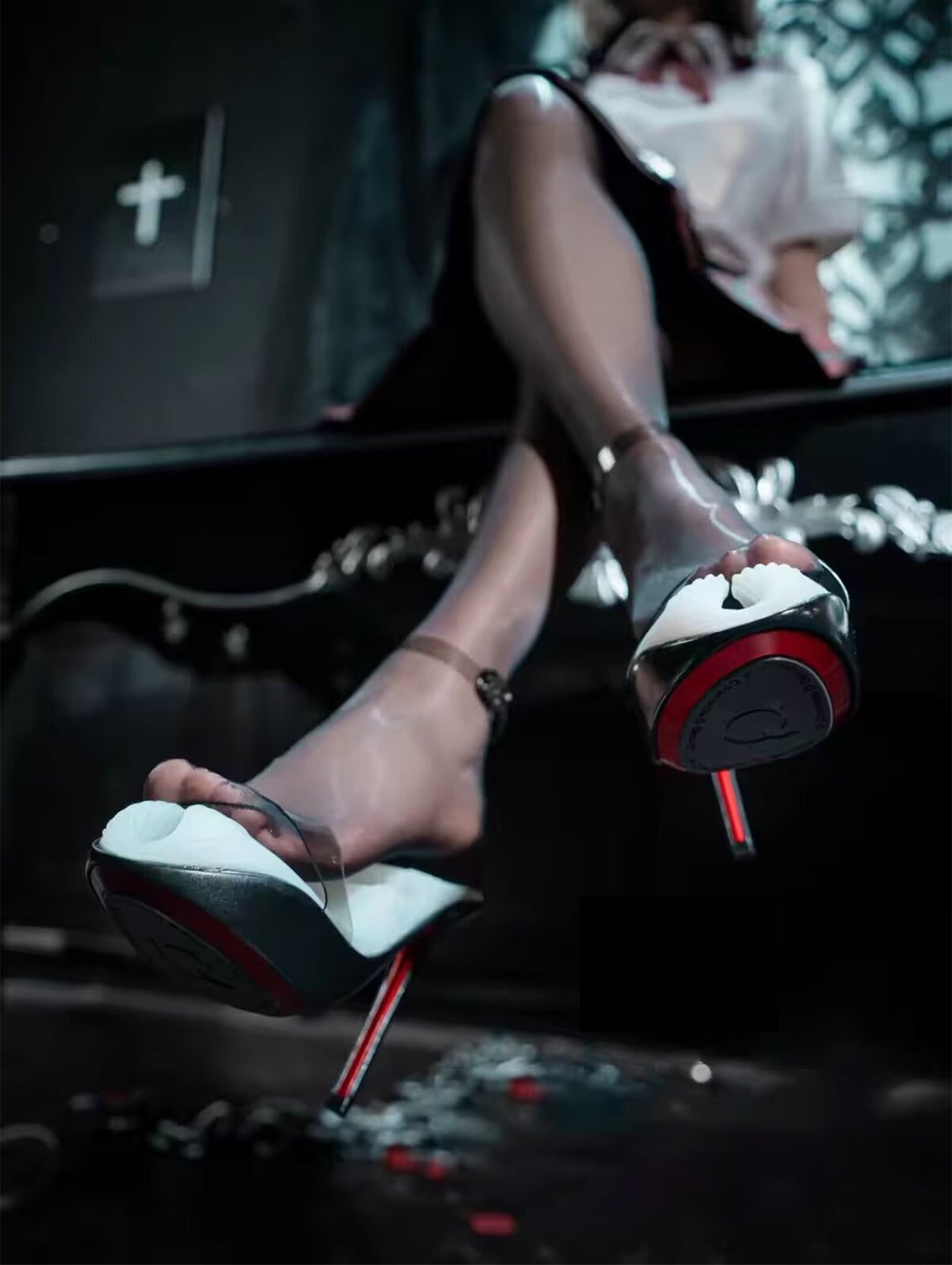 Bottom perspective of high heel stroker shoe with red bottom and inner channel opening
