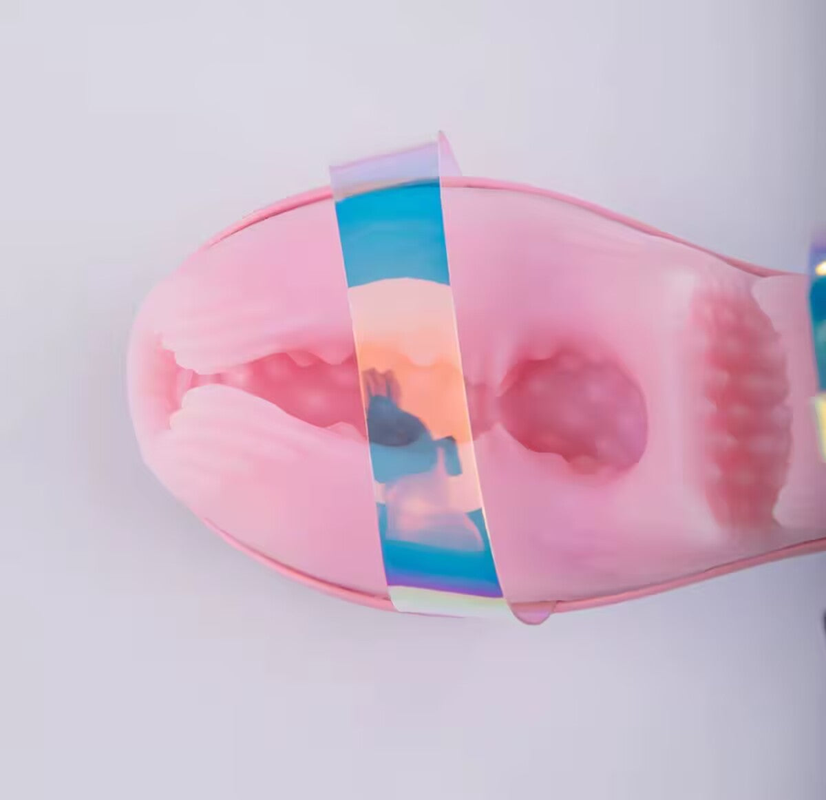 Top-down view showing the entry opening and inner textured sleeve of the pink high heel stroker