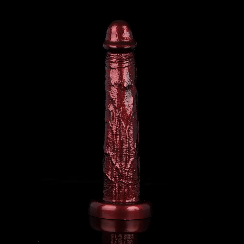 Front view of a huge burgundy realistic dildo with pronounced veins, standing erect on a strong suction cup base.