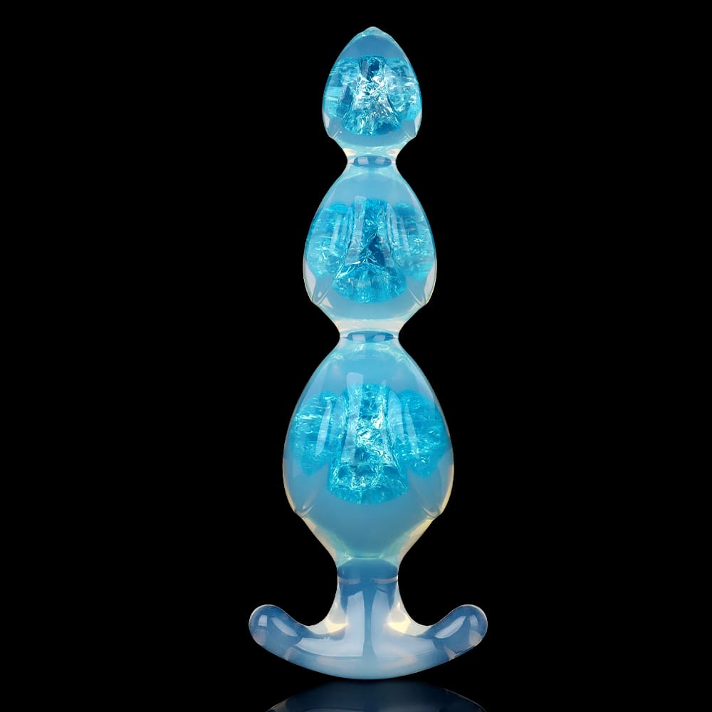 Aesthetic ice blue crystal jelly butt plug with flexible flared T-bar base for safe intimate training.