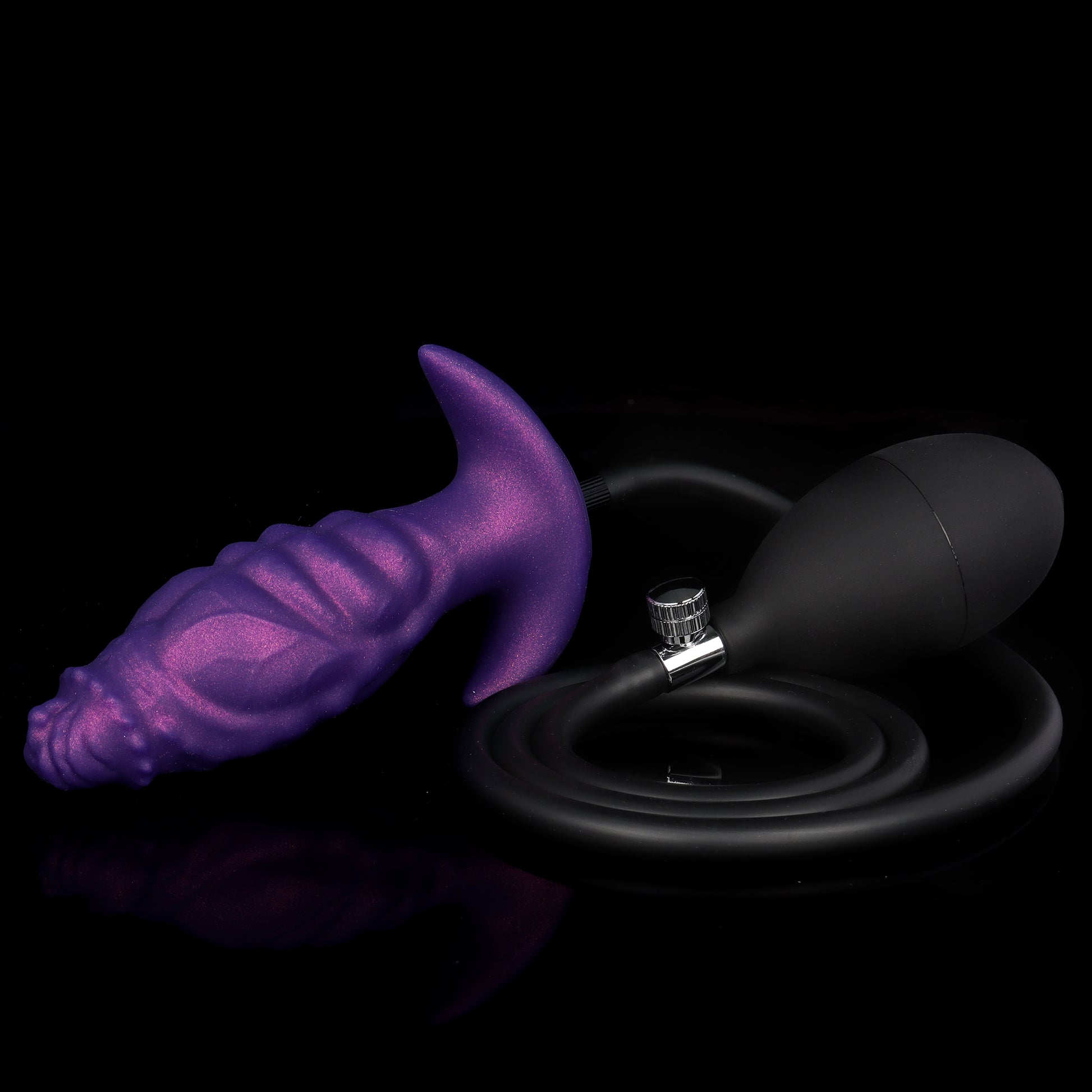 A complete inflatable anal toy kit featuring a purple textured plug connected to a flexible black hose and ergonomic rubber hand bulb pump.