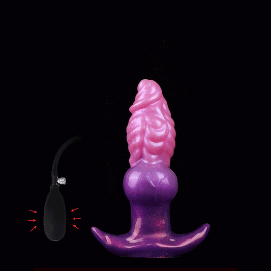 Animated GIF showing a dual-color pink and purple fantasy dragon butt plug expanding from a slim shape to a large size using a hand air pump bulb.
