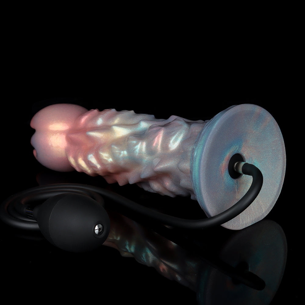 Bottom view of the premium fantasy dildo showing the wide suction cup base and the secure metal connection where the black inflation air hose hooks into the toy.
