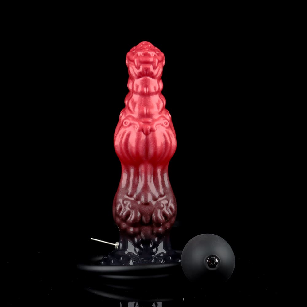 The red and black gothic fantasy inflatable dildo shown alongside its black manual bulb pump, air tube, and silver quick-release metal deflation valve.