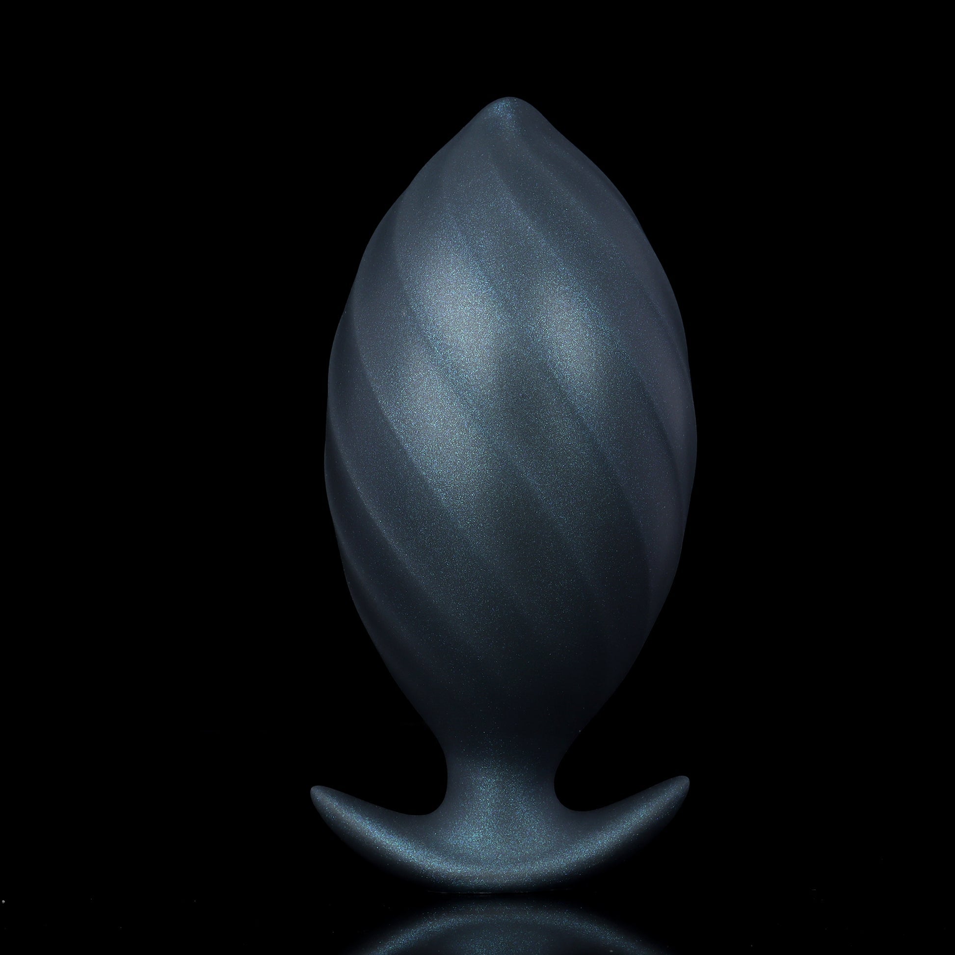Side profile of the inflated silicone e-stim trainer plug showing the dramatic bulbous expansion and sleek curves for progressive stretching.