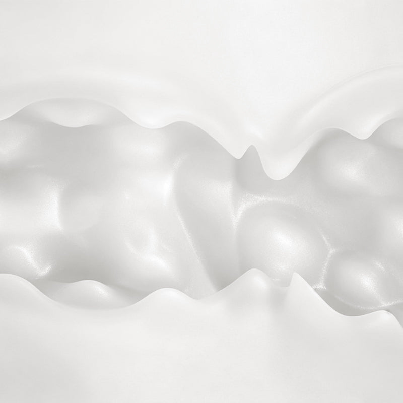 Extreme macro close-up inside white silicone inner channel showing contoured textures and stimulation dots