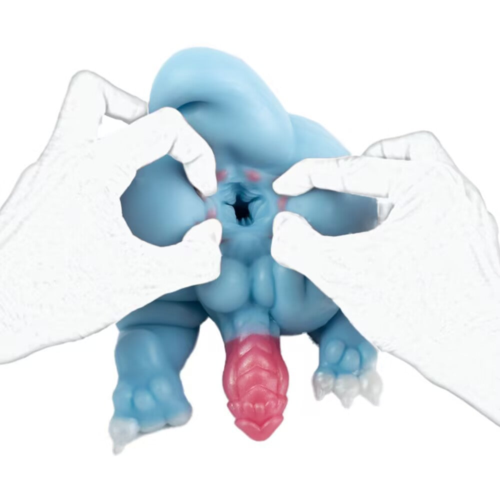 Hands spreading the upper entry of the Azure dragon silicone toy to reveal the highly detailed internal ribbed textures.