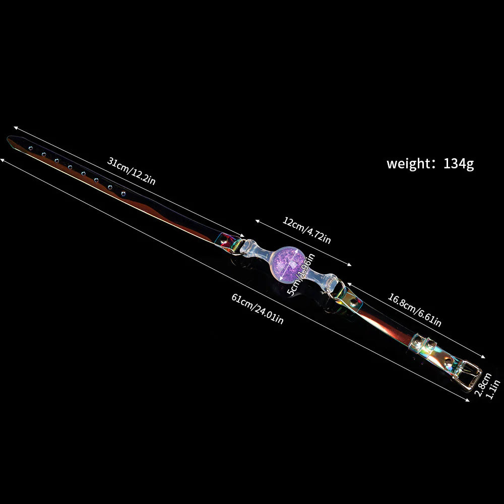 Weight and size chart for an iridescent purple silicone ball gag with a 5cm large clear glitter sphere, 61cm strap length, and 134g mass.