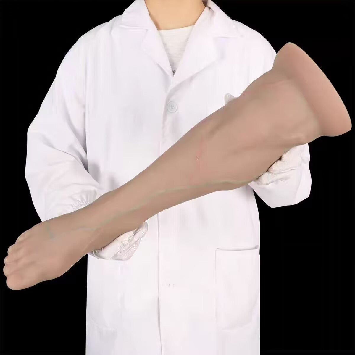 Hands-holding view of a large realistic foot butt plug displaying overall length, flexibility, and ergonomic design.