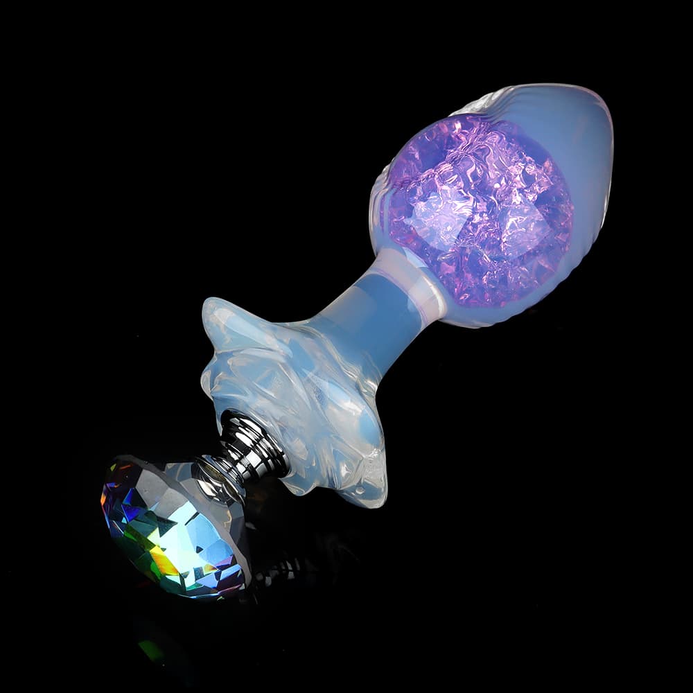 Opal glass butt plug featuring a massive luxury faceted rhinestone on the flared base