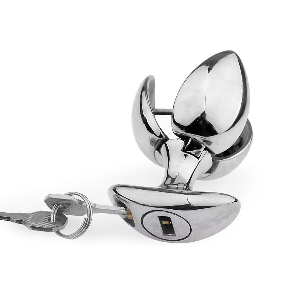 Close-up view of key inserted into lockable silver metal plug base for lock operation.