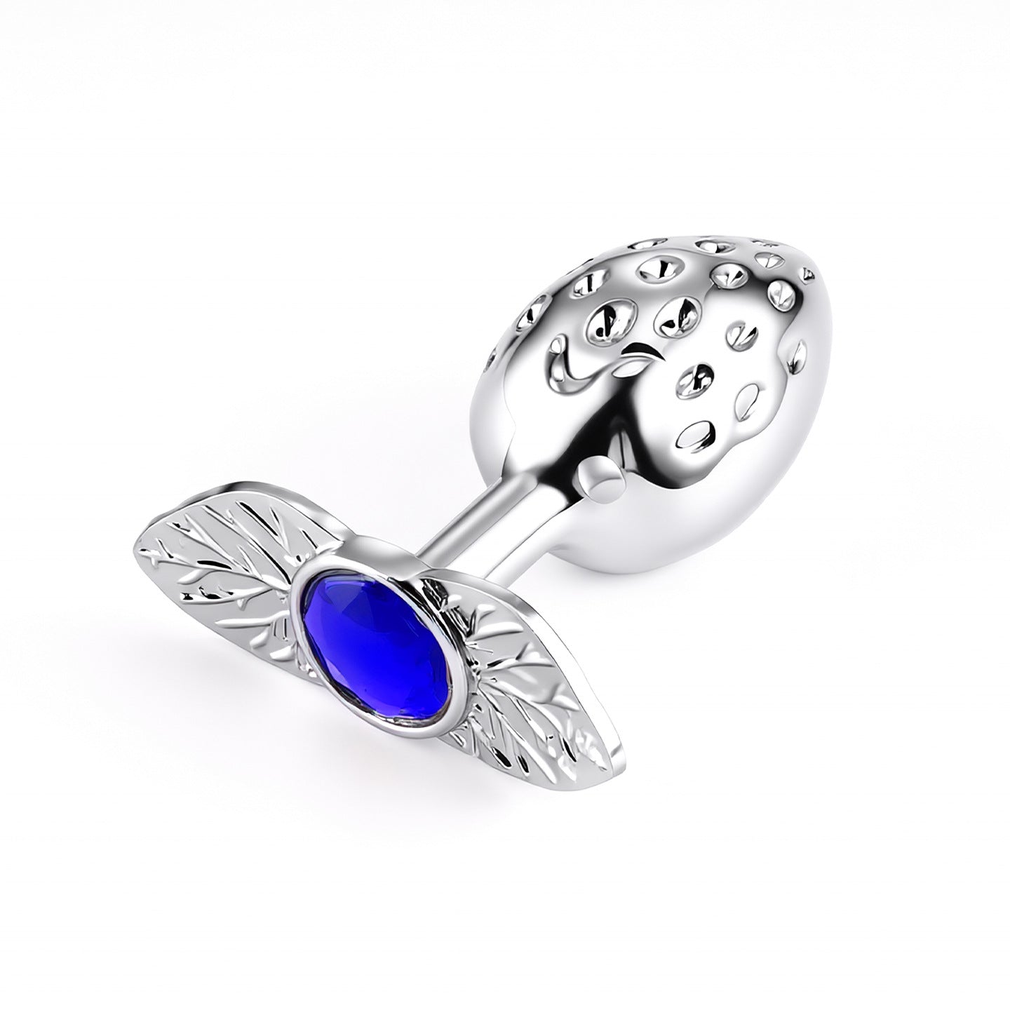 A body-safe metal strawberry butt plug on a white backdrop, highlighted by a deep sapphire blue crystal gem on its ergonomic leaf-shaped base.