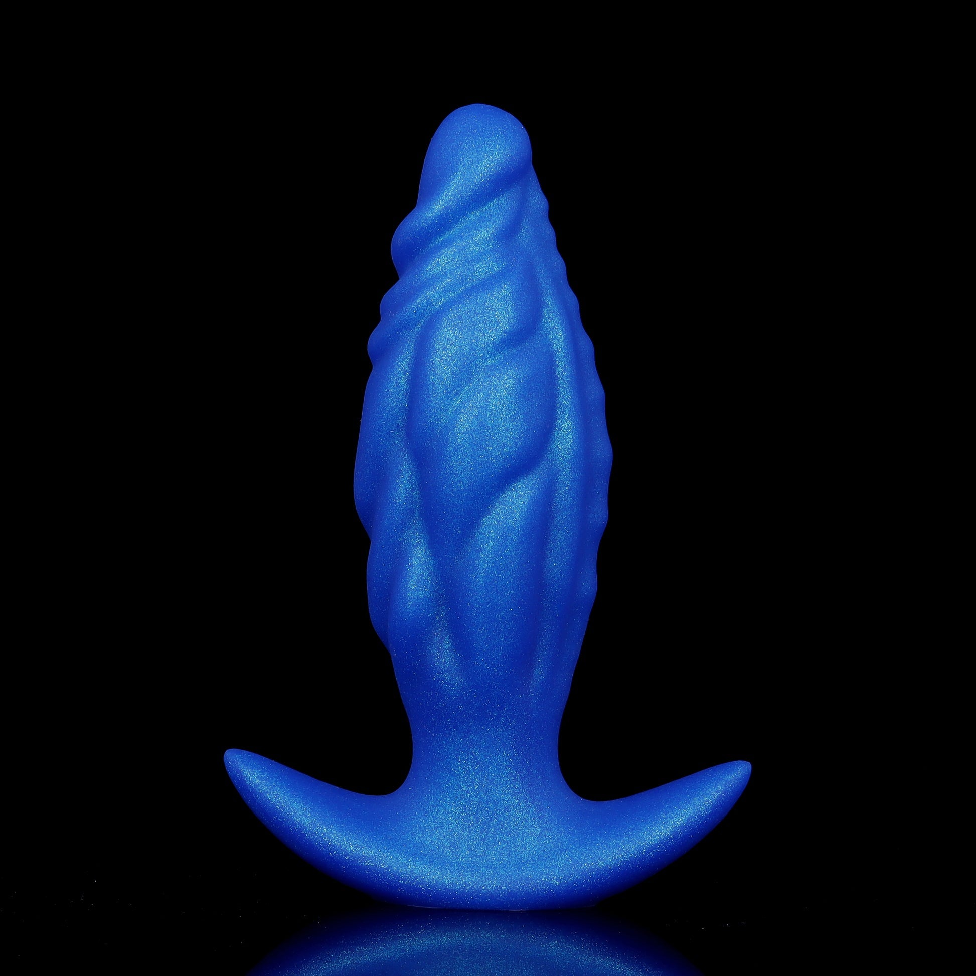 Midnight blue ribbed medical-grade silicone anal dilator with wavy contours and an ergonomic wide anchor safety handle.